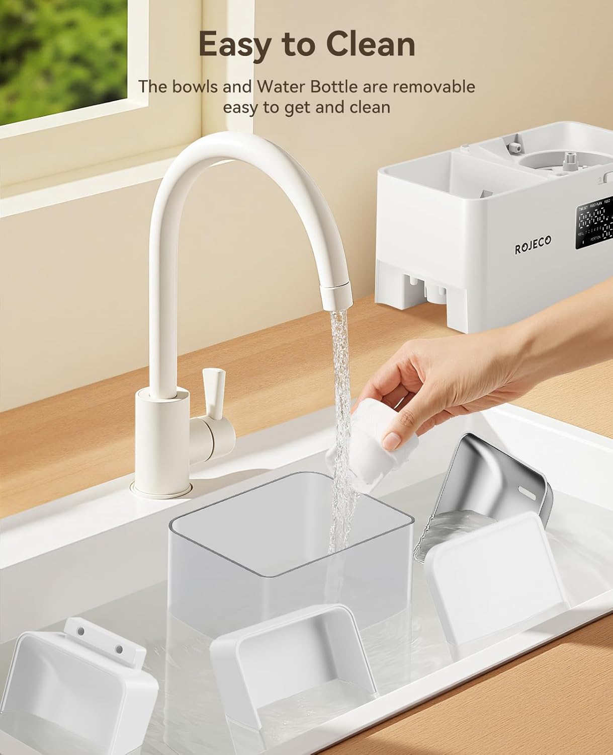 Image of the Rojeco 2-in-1 Automatic Cat Feeder and Water Dispenser featuring a 5L dry food container and a 3.5L gravity water system. The feeder includes stainless steel bowls for hygienic feeding and BPA-free construction to support pet health. The transparent containers allow easy monitoring of food and water levels, while the programmable feeding function enables controlled meal portions throughout the day. LED indicator alerts help ensure consistent food flow, and dual power support (Type-C and AAA bat