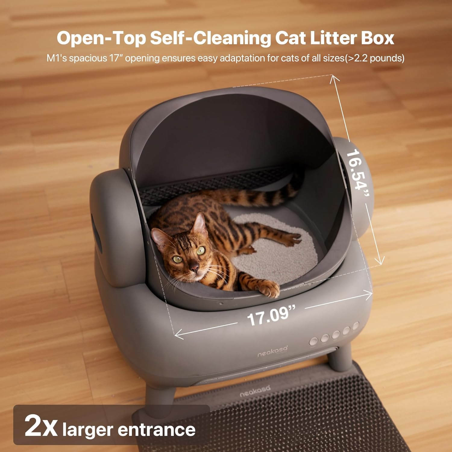 Neakasa M1 Open-Top Automatic Self-Cleaning Cat Litter Box shown in a modern home setting. The litter box features a spacious open-top layout designed to help cats feel comfortable while maintaining a low-stress environment. The design includes a sealed waste compartment for strong odor control and a quiet automated cleaning cycle that helps reduce daily scooping. The unit connects to a mobile app for usage tracking, cleaning reports, and reminders. Suitable for one or multiple cats, this automatic litter b