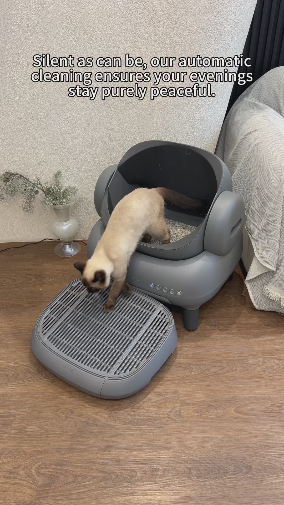 Neakasa M1 Open-Top Automatic Self-Cleaning Cat Litter Box shown in a modern home setting. The litter box features a spacious open-top layout designed to help cats feel comfortable while maintaining a low-stress environment. The design includes a sealed waste compartment for strong odor control and a quiet automated cleaning cycle that helps reduce daily scooping. The unit connects to a mobile app for usage tracking, cleaning reports, and reminders. Suitable for one or multiple cats, this automatic litter b